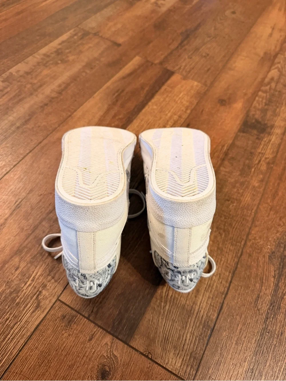 Nike Women’s High-Top Sneakers in White with Black Patterned Swoosh